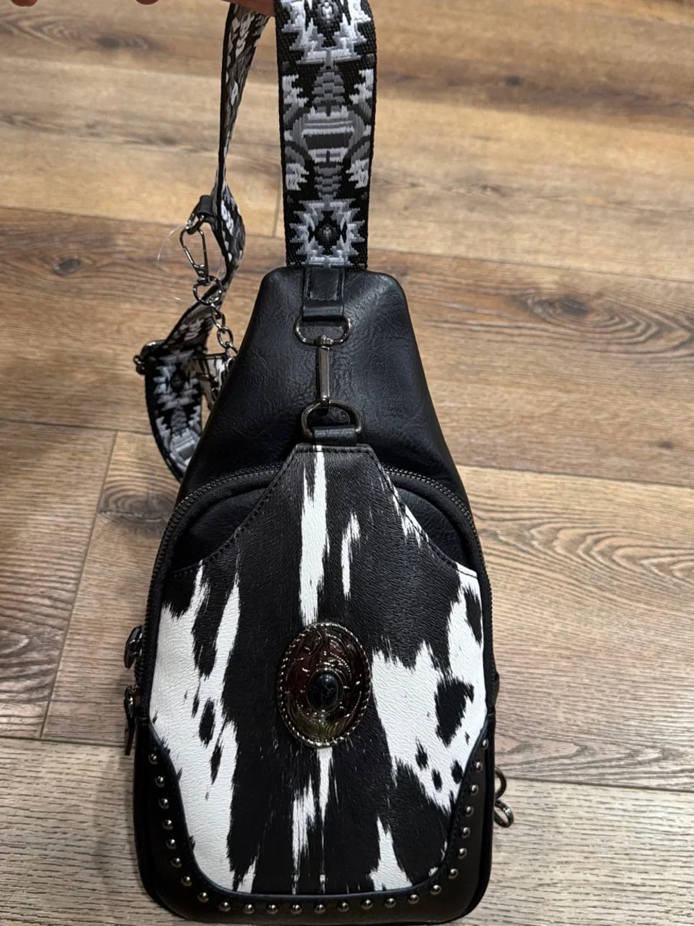 Black & White Cowhide Crossbody Sling Bag with Concho Accent
